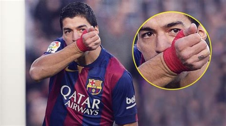 Why do soccer players kiss their wrist?